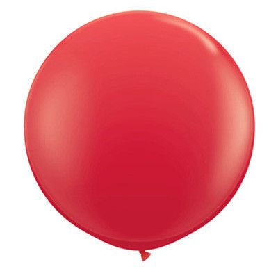 a red balloon floating in the air