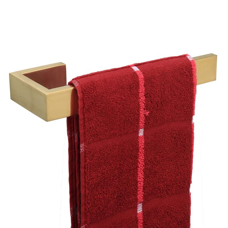 a red towel hanging on a wooden rack