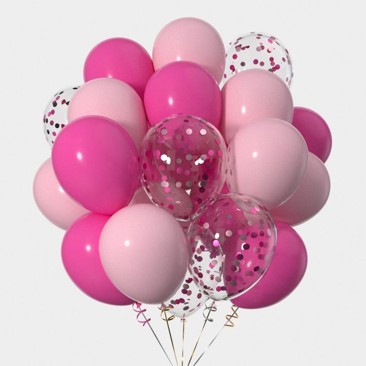 a bunch of pink and white balloons with confetti