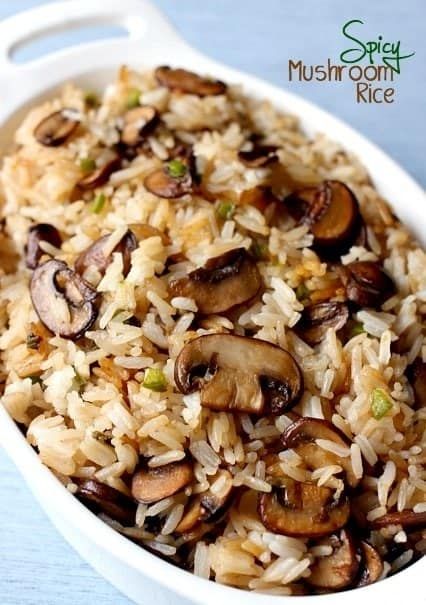 mushroom rice in a white bowl on a blue table