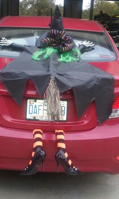 a red car with black and green decorations on it