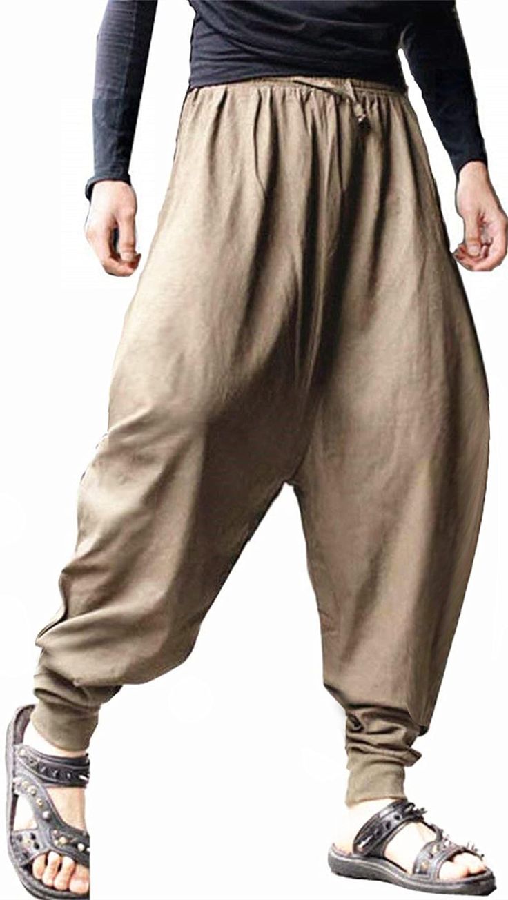 PRICES MAY VARY. The wide elastic waistband design allows you to adjust your pants to make them more comfortable and accommodates any weight fluctuations. These casual hippie harem pants for men and women feel so comfy and breathable, you'll never want to wear anything else! Perfect for the Halloween, dance, cosplay, casual wear, outing, lounging around the house or in the park. The men's baggy harem pants are made of soft fabric, comfortable and breathable,harem trousers with wide leg and 2 sla Hakama Trousers, Camisa Rock, Ceremonial Clothing, Linen Harem Pants, Harem Pants Men, Cotton Harem Pants, Harem Trousers, Fall Pants, Loose Trousers