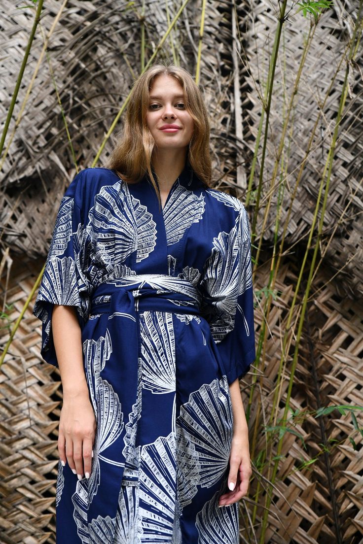 The kimono has a loose swing shape for an easy, flowy fit making it extremely comfortable to wear. The palm leaf  Print covers the entire front and back panel and is piped in a lovely contrast colour. Use the belt included with the dress if you prefer a more fitted look. Our kimono comes in 4 sizes and 3 lengths, Size: *SMALL will fit size UK 8-12 /US 4-8 . Width is 120cm. Will fit up to a bust measurement 92 cm to allow for a 15 cm each side overlap *REGULAR will fit size UK 14-16/US 10-12. Wid Beach Kimono With Belted Kimono Sleeves, Summer Kimono With Belted Kimono Sleeves, Summer Kimono With Belted Waist And Kimono Sleeves, Belted Kimono For Beach, Beach Kimono With Belt, Summer Beach Kimono With Belt, Belted Kimono With Kimono Sleeves For Vacation, Summer V-neck Belted Kimono, Palm Leaves Print