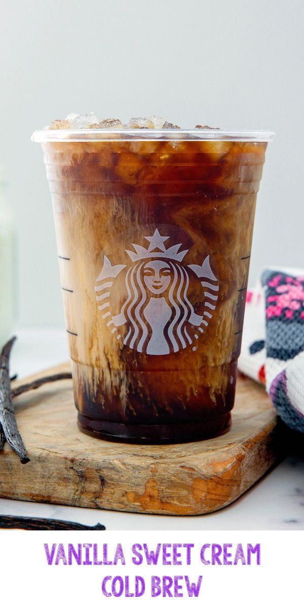 vanilla sweet cream cold drink in a plastic cup on a wooden tray with other items