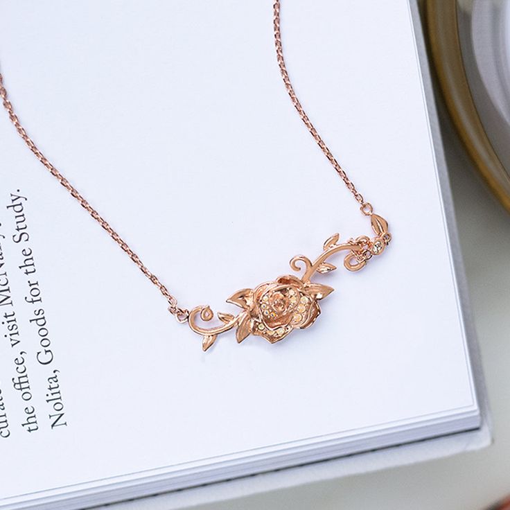 Disney Rose Gold Belle's Roses Necklace 16-19"– Think Goodness Delicate Rose Gold Flower Necklace With Clavicle Chain, Dainty Rose Gold Flower Necklace With Clavicle Chain, Rose Gold Jewelry With Roses For Her, Feminine Rose Gold Jewelry With Rose Design, Valentine's Day Rose Gold Necklaces With Rose Design, Delicate Rose Gold Jewelry With Rose Design, Dainty Rose Gold Flower Necklace As Gift For Her, Elegant Roses Necklace For Mother's Day, Dainty Rose Gold Necklace With Rose Design