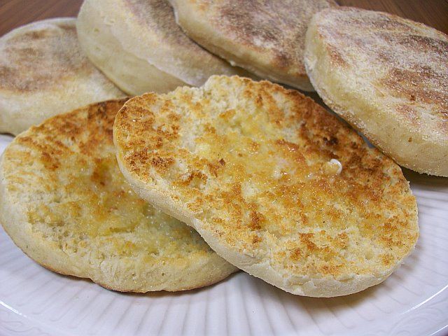 four english muffins on a white plate