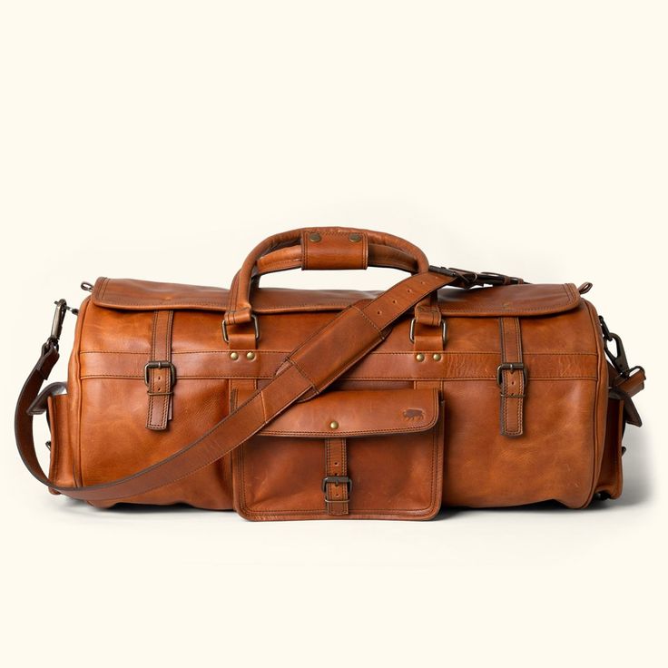 Roosevelt Buffalo Leather Travel Duffle Bag | Autumn Brown Rugged Shoulder Bag For Travel, Rugged Leather Travel Bag For Overnight Trips, Leather Shoulder Bag For Outdoor Use, Leather Duffle Bag With Waxed Finish For Weekend Trips, Rugged Travel Bag, Rugged Waxed Finish Bags For Overnight Trips, Rugged Waxed Weekender Bag For Travel, Rugged Brown Travel Bag For Overnight Trips, Rugged Travel Bag With Luggage Sleeve