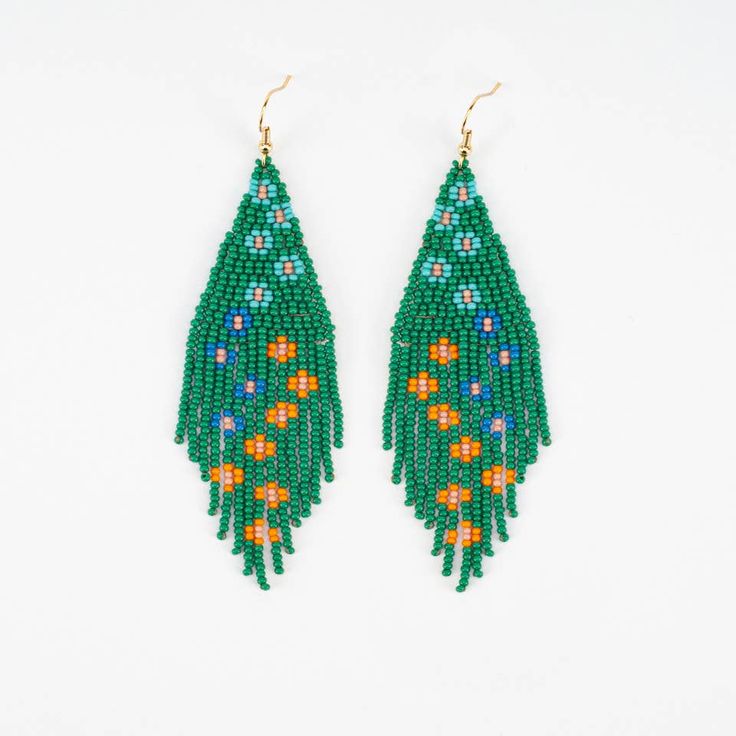 Splashes of colorful flowers cascade down the design of the unique hand beaded earrings. Glass beads and gold plate french ear wire. 3.75 inches long x 1.25 inches wide The Flower Cascade Earrings are handmade in a fair trade workshop in Guatemala. Green Dangling Bead Flower Earrings, Green Dangle Flower Earrings With Beads, Green Dangle Earrings With Dangling Beads, Green Flower Drop Earrings With Dangling Beads, Bohemian Green Flower Earrings With Dangling Beads, Green Beaded Flower Drop Earrings, Green Beaded Drop Flower Earrings, Green Colorful Beaded Dangle Flower Earrings, Green Dangle Flower Earrings With Colorful Beads