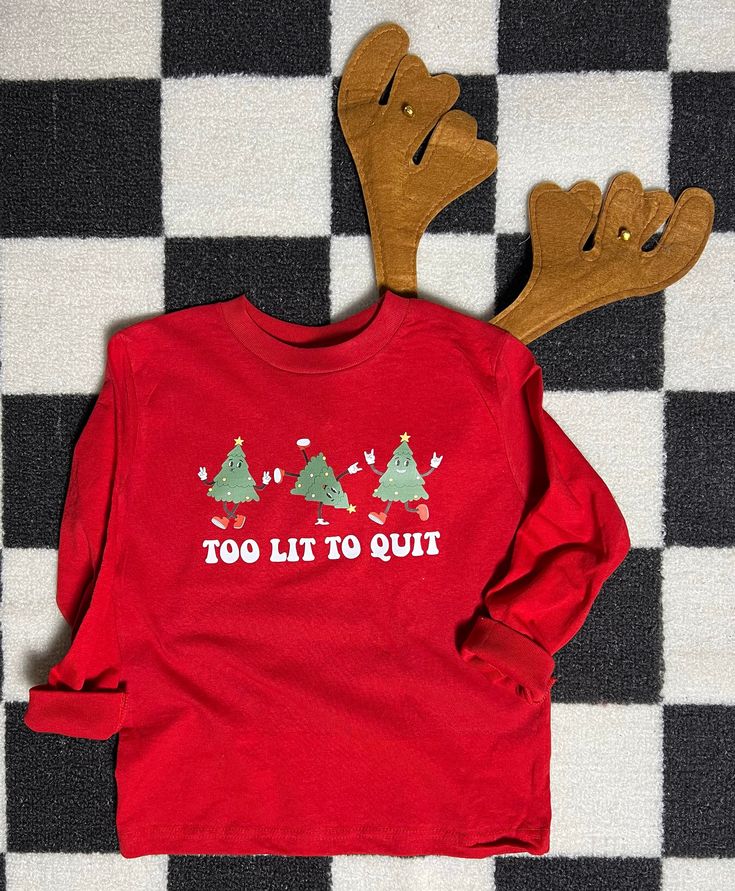 "Looking for a fun and festive t-shirt for your little one this Christmas? Look no further than our \"Too Lit To Quit\" Christmas tree tee! Perfect for kids who love the magic and excitement of the holiday season, this retro themed shirt is sure to bring a smile to everyone's face. Made from soft and comfortable material, it features a bold and playful design that is sure to stand out in any crowd. So why wait? Get your child(ren) and family ready for Christmas in style with our fun tee today!  All items are made to order in the order in which they are received so please allow up to 7 business days for your order to be shipped out. We will always try to get orders out as fast as possible. :)  **If you need your order delivered by a certain date please leave a note in the notes to seller** Holidays With Toddlers, Kid Christmas, Funny Holiday Shirts, Christmas Shirts For Kids, Christmas Look, Tee Tree, Ready For Christmas, Funny Christmas Shirts, Kids Graphic Tees