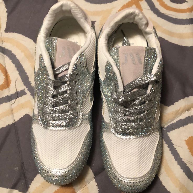 White And Silver Sneakers Covered In Rhinestones, Brand New Never Worn, Small Size 8 White Synthetic Sneakers With Bling, Casual Bedazzled Sneakers, Casual White Sneakers For Party, Casual White Party Sneakers, Silver Sneakers With Rhinestones For Spring, Spring Silver Sneakers With Rhinestones, Silver Rhinestone Sneakers For Spring, White Party Sneakers With Rhinestones, Trendy White Sneakers With Rhinestones