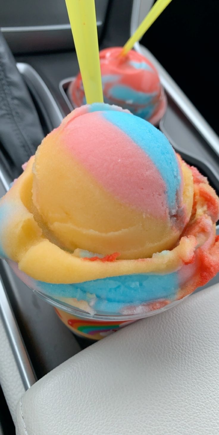 two scoops of colorful ice cream in a car