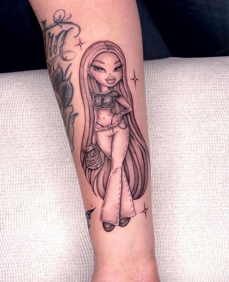 a woman's leg with a tattoo on it and an image of a doll