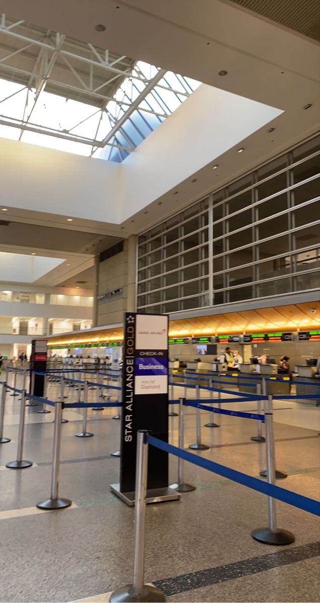 an airport terminal with blue and white lines