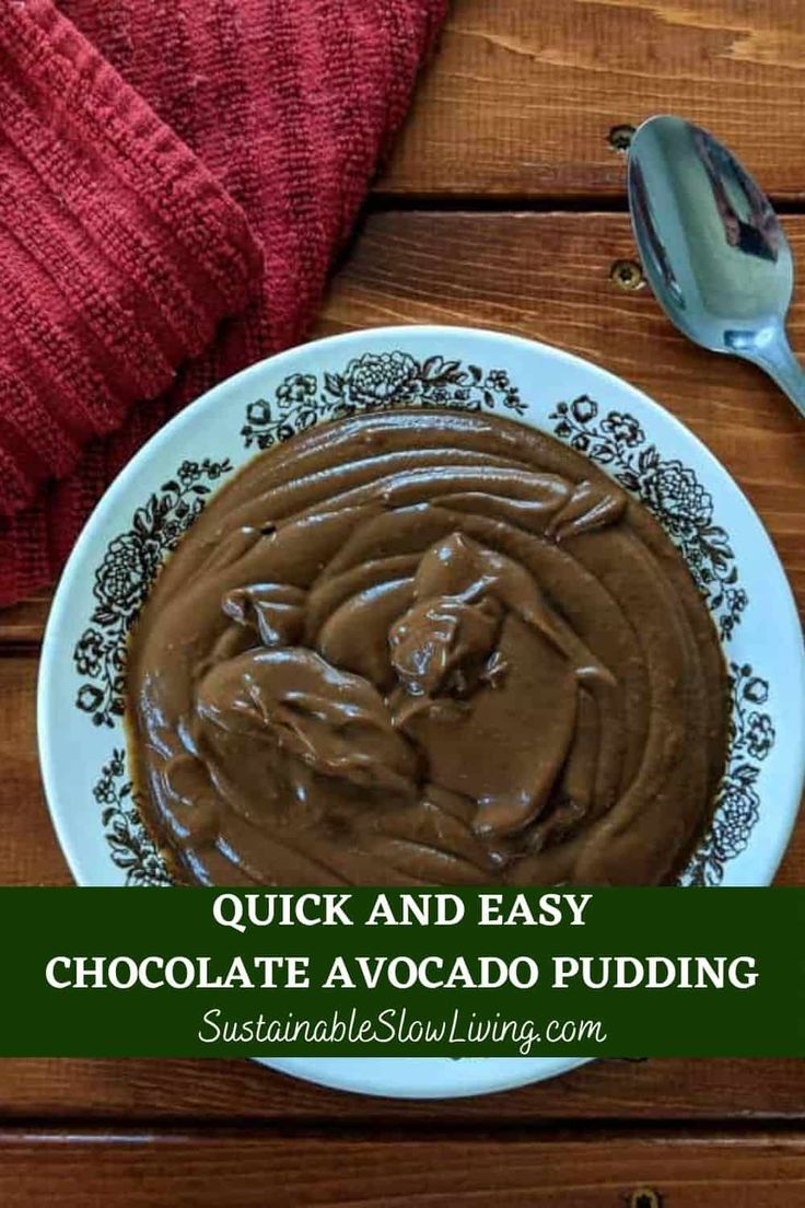 chocolate avocado pudding on a white plate with spoons and red towel in the background