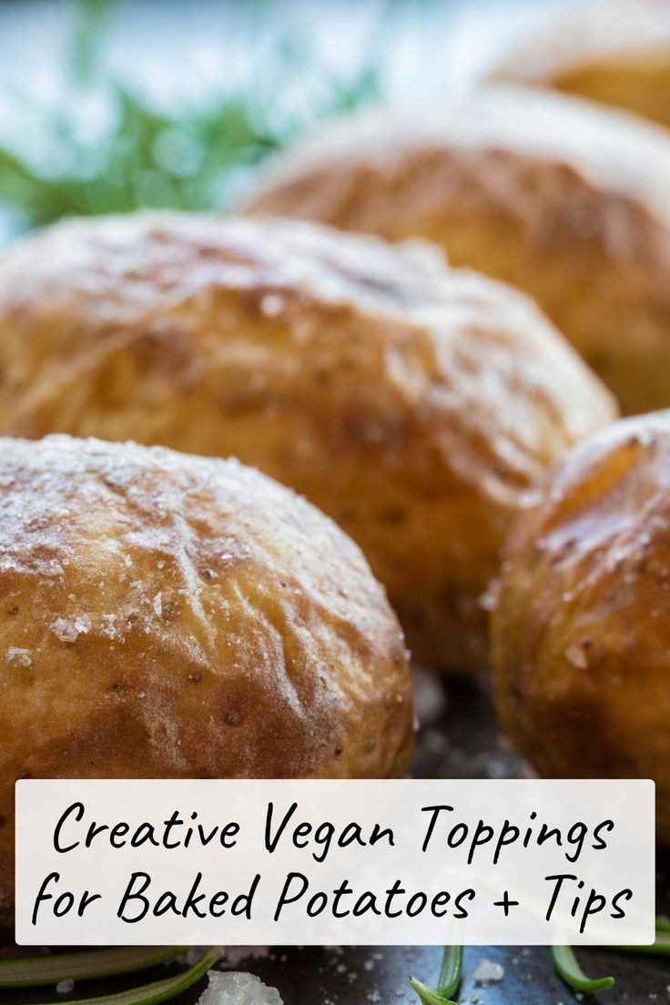 some breads sitting on top of a table next to green leaves and text that reads creative vegan toppings for baked potatoes - tips