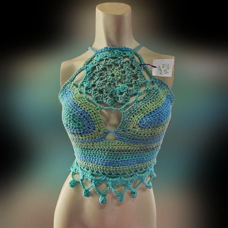 A Crocheted Handmade Mandala Designed Teal Green Crop Top. Perfect For Summer! All Purchases Support Future Art And My Family. Blue Sleeveless Halter Top For Festival, Fitted Turquoise Bohemian Tops, Fitted Bohemian Turquoise Tops, Green Bohemian Halter Top For Beach Season, Blue Crop Top For Spring Festival, Handmade Blue Bohemian Tops, Handmade Bohemian Blue Tops, Handmade Blue Tops For Festival, Blue Spring Festival Halter Top