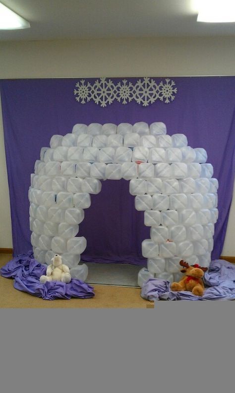 an arch made out of balloons and stuffed animals on the floor in front of it