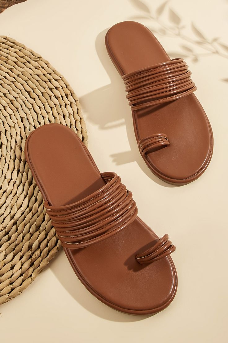 Step into comfort and style with our Faux Leather Toe-Ring Slide Sandals. These sandals feature a trendy toe-ring design and a sleek faux leather finish, ideal for sunny days and casual outings. Product code: CAB01B4F004JJ Features:  Round toe Toe ring Slip-on styling. Synthetic Toe Loop Sandals For Vacation, Trendy Toe Loop Sandals With Synthetic Material, Trendy Toe Loop Synthetic Sandals, Trendy Synthetic Toe Loop Sandals, Open Toe Faux Leather Beach Sandals, Faux Leather Open Toe Sandals For Beach, Open Toe Faux Leather Sandals For Beach, Trendy Brown Sandals With Single Toe Strap, Trendy Single Toe Strap Sandals For Vacation