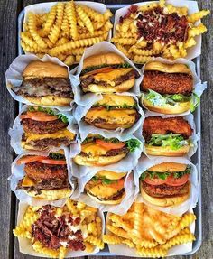 a tray filled with lots of different types of burgers