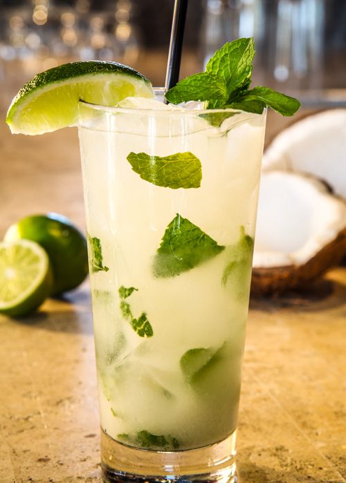 a mojito cocktail with lime and mint