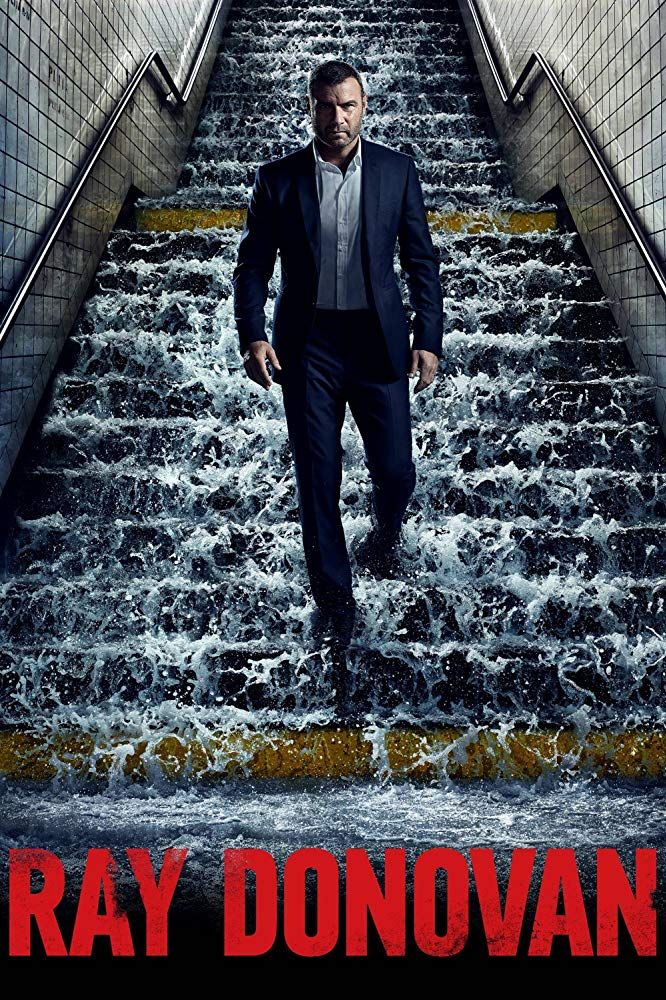 a man in a suit is walking up some stairs with water flowing down the sides