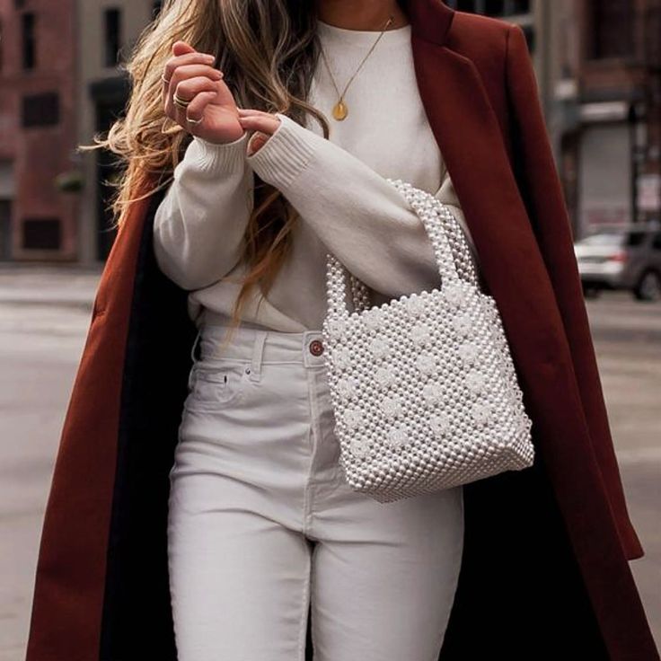 This cream Dominique beaded bag features a square body, round top handles, a beaded construction, an open-top design. This bag is the perfect feminine-chic touch to your look. Pair it with jeans for a casual stroll.PVC 100% Cream Shoulder Bag With Pearl Handle, Cream Top Handle Shoulder Bag With Pearl Handle, Tote Bag With Pearl Handle, Trendy Tote Shoulder Bag With Pearl Handle, Chic Everyday Bags With Pearl Handle, Cream Shoulder Bag With Pearl Handle For Shopping, Trendy Shoulder Bag With Pearl Handle For Shopping, Trendy Shopping Shoulder Bag With Pearl Handle, Beige Square Bag With Pearl Handle