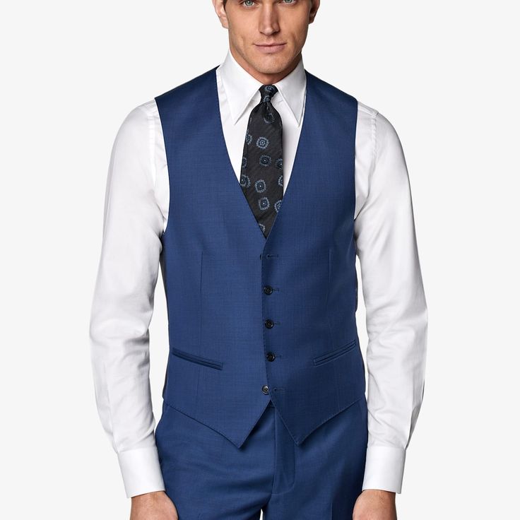 Mid blue waistcoat with a slim fit, featuring a V-neck collar, jetted pockets, single-breasted 5-button closure, and a rear cinch for an adjustable fit. Elegant Blue V-neck Vest, Business Vest With Single Button Sleeveless, Business Vest With Single Button, Business Sleeveless Vest With Single Button, Formal Blue V-neck Outerwear, Single Breasted Lapel Collar Vest For Business Casual, Semi-formal Single-breasted Vest With Lapel Collar, Sleeveless Single Breasted Blazer For Business, Sleeveless Single-breasted Business Blazer