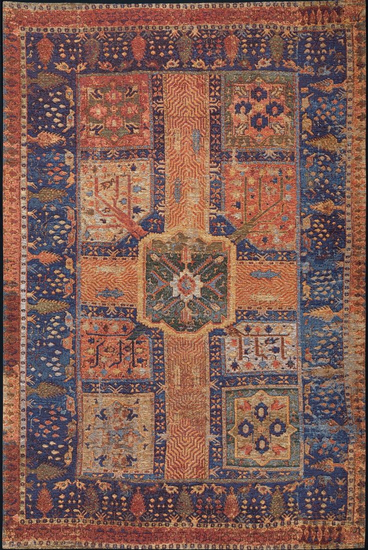 an old rug with many different colors and patterns