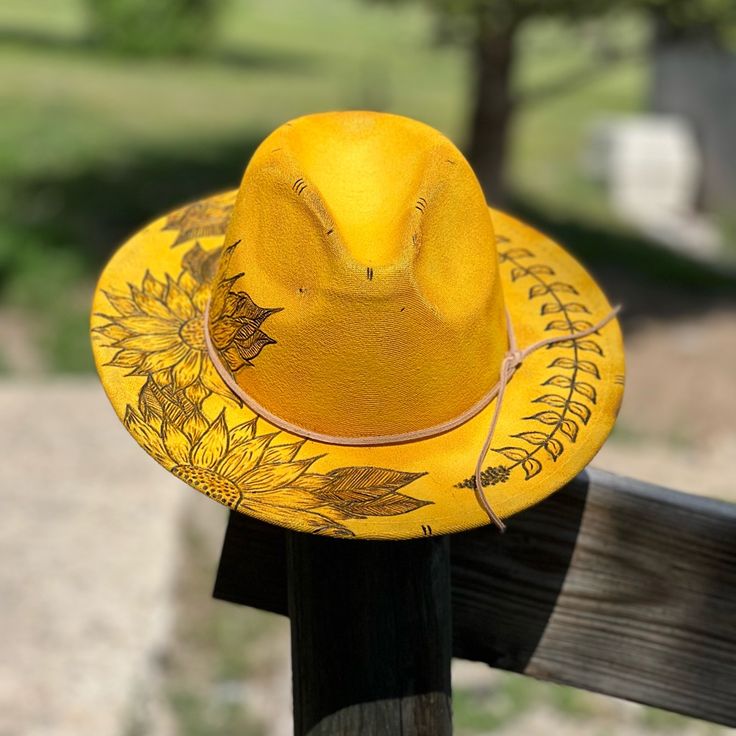 Yellow Hand Burned Sunflower Hat. Drawstring Inside Hat To Size. Insta- @Ljr.Creations And Www.Ljrcustomcreations.Com For More Of My Custom Designs ! Custom Fedora For Beach In Spring, Custom Beach Fedora For Spring, Artisan Fitted Summer Hat Bands, Yellow Adjustable Fedora For Kentucky Derby, Adjustable Yellow Fedora For Kentucky Derby, Adjustable Yellow Fedora For Spring, Spring Yellow Adjustable Hat Bands, Yellow Bohemian Hat With Flat Brim, Handmade Fitted Fedora For Spring