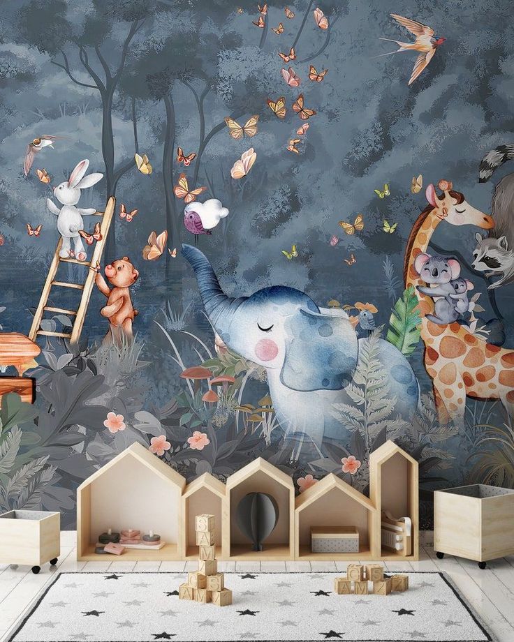 a child's room decorated in blue and grey with an elephant mural