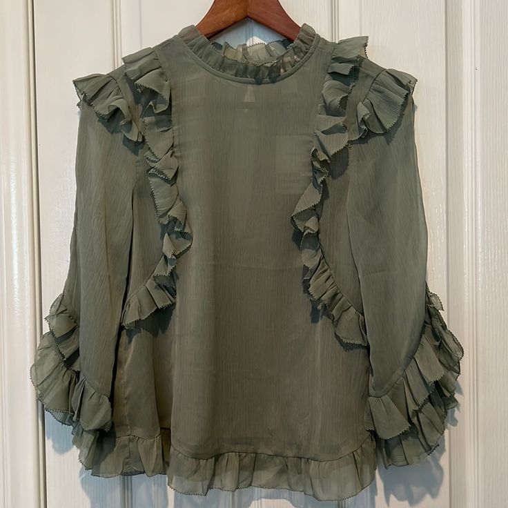 H&M Blouse Size 4 Made In India 100% Polyester Ruffle Design Like A Sage Green Color Button And Loop Closure On Nape Feminine Green Tops For Workwear, Spring Green Ruffled Shirt, Green Ruffled Top For Office, Trendy Button-up Blouse By H&m, Trendy Button-up Blouse From H&m, Trendy Button-up H&m Blouse, H&m Summer Office Tops, H&m Trendy Long Sleeve Blouse, Trendy Long Sleeve H&m Blouse