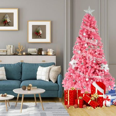 a pink christmas tree in a living room