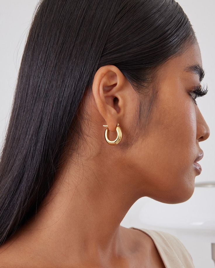 This is a small size huggie earrings. The deigns is classic, clean and sleek. Each piece is hand polished and quality inspected to assure a perfect finish. The earrings are made in silver metal and plated with 18K yellow gold or white gold. A classically timeless pair of hoops. Closure: Hoop Stamp Approx. Measurement: Outer Length: 0.8 inches Outer Width: 0.65 inches Silver Weight: Approx. 0.12 oz Classic Everyday Gold Plated Hoop Earrings, Classic Gold Plated Huggie Earrings, Classic Gold-plated Huggie Earrings, Classic Gold Plated Tarnish Resistant Hoop Earrings, Timeless Small Hoop Tarnish Resistant Earrings, Classic Gold Small Hoop Huggie Earrings, Timeless Huggie Hoop Earrings For Everyday, Timeless Tarnish-resistant Huggie Earrings For Everyday, Everyday Timeless Huggie Hoop Earrings