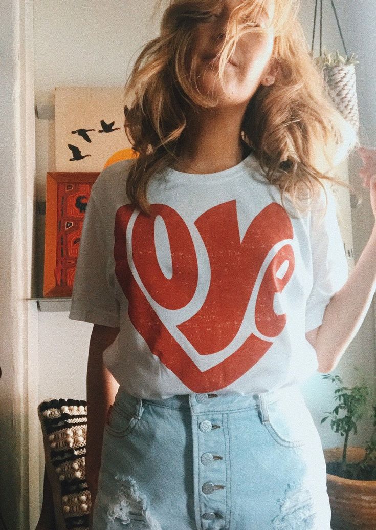 Spread positive vibes with this 70's inspired retro graphic tee. White unisex/boyfriend fit tee. If you're interested in a fitted garment order a size down. This tee is made to order. Allow up to 7 business days for production and shipping. *SIZING CHART IS IN PRODUCT IMAGES* Trendy T-shirt With Heart Graphic For Everyday, Retro Red Tops With Slogan, Red Retro Slogan Tops, Retro Summer Tops With Heart Graphic, Retro White T-shirt With Heart Graphic, Retro Cotton T-shirt With Heart Graphic, Retro Screen Print T-shirt For Everyday, Retro Crew Neck Top With Heart Graphic, Retro Graphic Tees