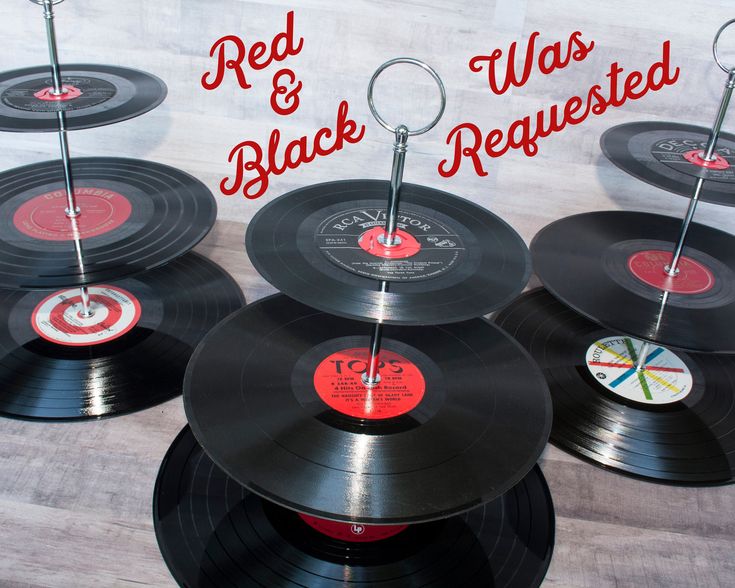 several black records with red and white labels on them are arranged in a circle to spell out the word red & black was rerequested