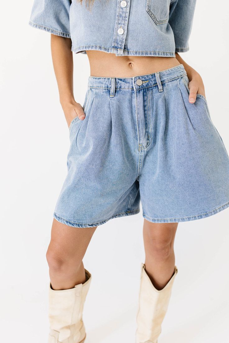 the perfect summer outfit exists, + it’s this iconic denim-on-denim moment. comprised of a boxy short sleeve denim top + matching pleated denim shorts, this casual two-piece set serves some serious 90s nostalgia. whether worn together or separately, it’s a set you can count on to slay the day. light denim // collared, buttons, cropped, front breast pocket, high waisted, one button fly zip, belt loops, pockets, pleat detailing model is 5'8" + wearing a small measurements are approximate + taken w Medium Wash Button-up Denim Top With Buttoned Pockets, Medium Wash Button-up Denim Shorts, Washed Blue Relaxed Fit Button-up Denim Top, Medium Wash Denim Top With Pockets, Short Sleeve, Medium Wash Denim Button-up Top With Pockets, Short Sleeve Denim, Slay The Day, Pleated Denim, Denim Set