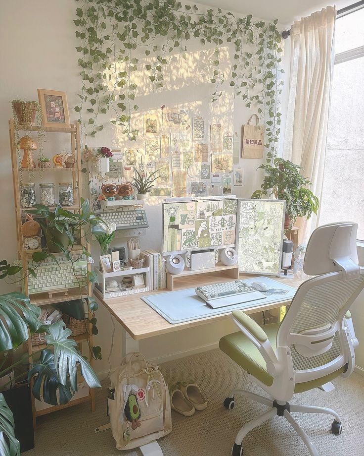 a home office with plants on the wall and computer desk in front of it,