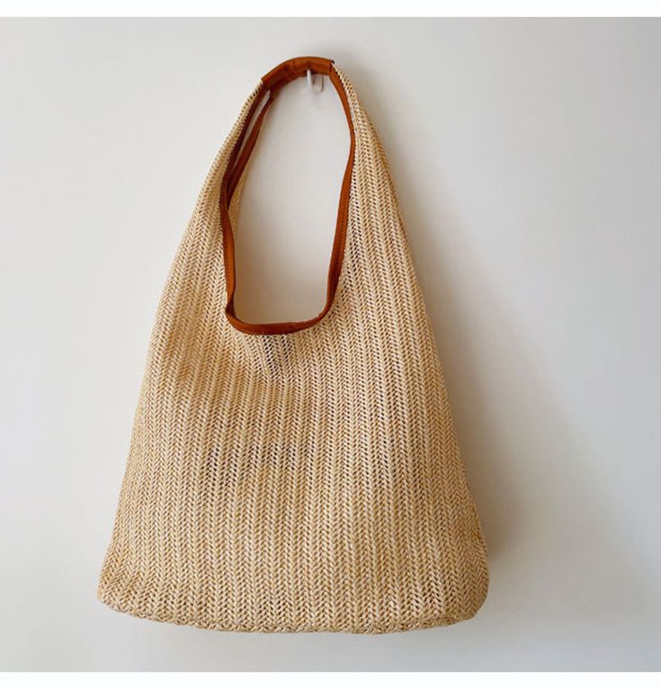 Lightweight straw woven tote bag perfect for all occasions. Size approximately 34cm wide x 25cm tall (13in x 10in) Designer Style ID: 8303 Beige Woven Shoulder Bag For Shopping, Woven Straw Bag With Double Handles, Beige Straw Shopping Bag, Beige Jute Straw Shoulder Bag, Beige Beach Bag With Braided Handles For Shopping, Vacation Woven Satchel Hobo Bag, Woven Satchel Hobo Bag For Vacation, Beige Handwoven Straw Bag With Double Handle, Beige Woven Beach Bag For Shopping