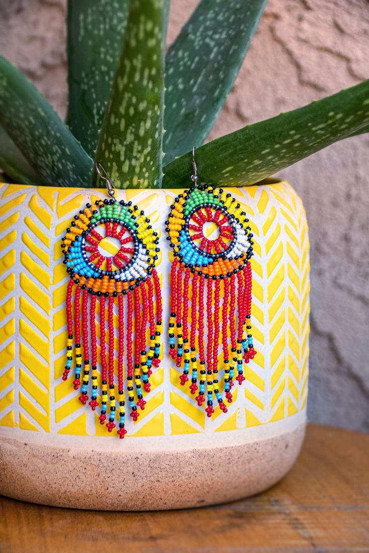 Zulu Beaded Tassel Earrings - Leone Culture Beaded Tassel Earrings For Beach, Multicolor Beaded Fringe Earrings With Unique Style, Large Beads Earrings For Party, Unique Multicolor Beaded Fringe Earrings, Adjustable Beaded Chain Earrings For Summer, Adjustable Beaded Chain Earrings For Party, Beaded Chain Earrings With Round Beads For Gifts, Unique Beaded Chandelier Earrings For Party, Beaded Chain Earrings As Gift