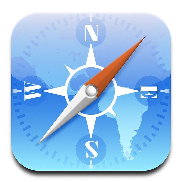 a compass icon with an orange arrow pointing in the direction of north and south america