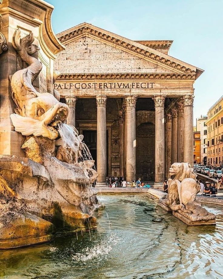 a fountain in front of an old building