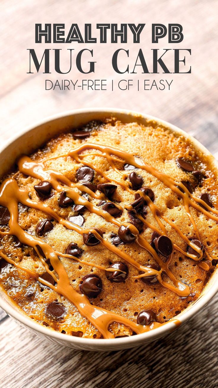 healthy pb mug cake with chocolate chips and caramel drizzle on top