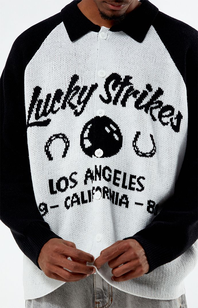 Step up your sweater game with the Lucky Strike Collared Sweater. Boasting a classic collared neckline, button closures, and long sleeves, this sweater offers both style and functionality. Its standout feature is the Lucky Strike Bowling knit design on the front, adding a touch of retro charm to your look.


	Collared neckline
	Button closures
	Regular fit
	Jacquard knit design
	80% Acrylic, 20% nylon
	Model is wearing size medium
	Model Measurements: 6'1” Height, 31” Waist, 32” Inseam Winter Varsity Jacket With Button Closure And Long Sleeves, Winter Varsity Jacket With Button Closure, Black Casual Varsity Jacket For Game Day, Casual Black Varsity Jacket For Game Day, Long Sleeve Streetwear Cardigan, Collared Black Sweater For Fall, Black Winter Varsity Jacket For Game Day, Black Varsity Jacket For Game Day In Winter, Winter Streetwear Button-up Varsity Jacket