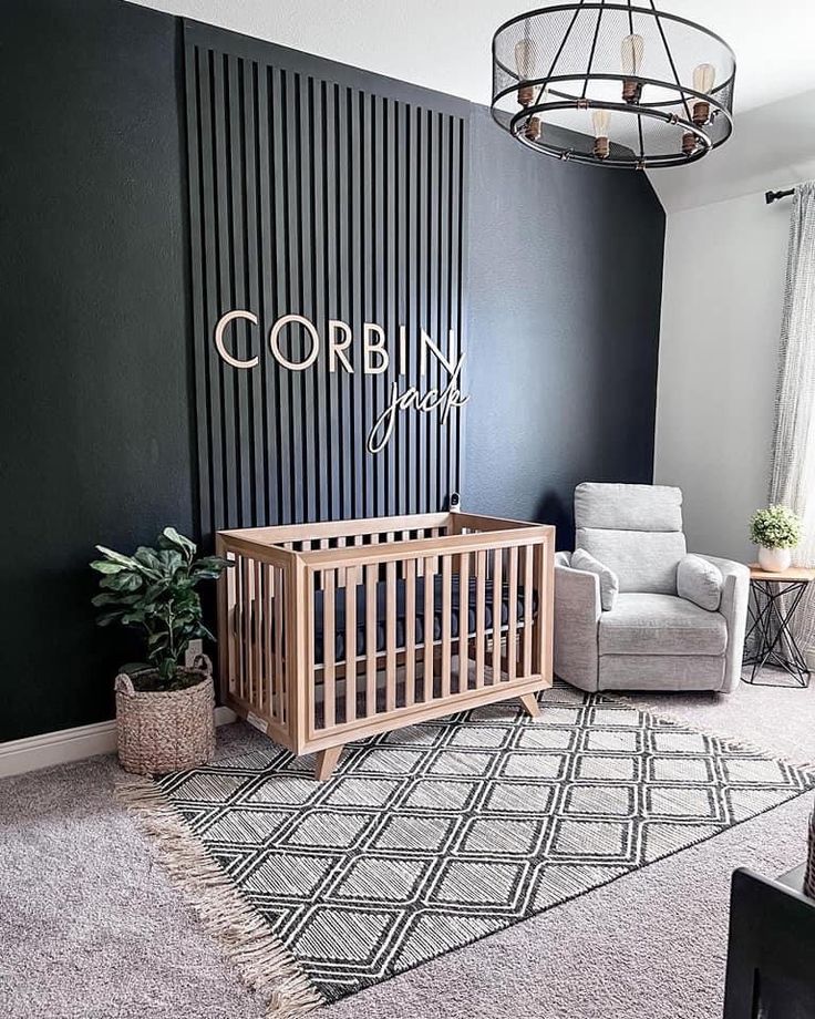 a baby's room with a crib, chair and rug