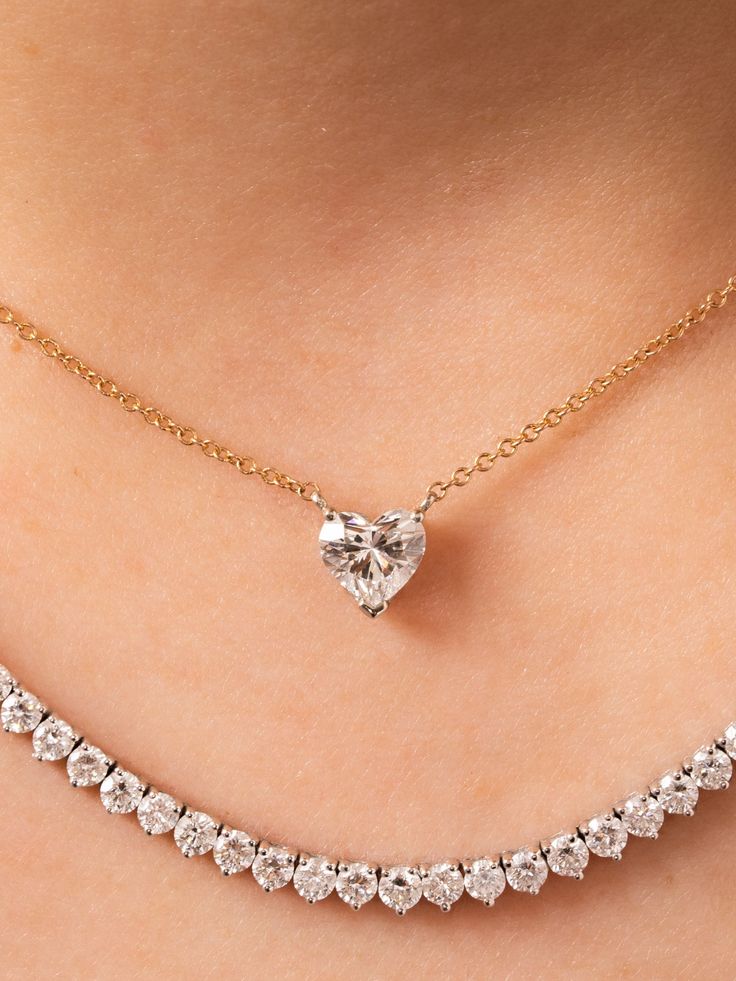 This beautiful diamond heart necklace is made to order. As always, we make a custom low profile basket for the heart diamond to sit in on a delicate 14K gold chain. It is perfect for wearing everyday on its own or layered with another necklace or two. 0.50ctw in stock is a G color SI2 clarity. Other sizes are custom made and can vary in color, clarity and cost. Available in 14K yellow, white or rose gold and the size of diamond vary based on your selection. This product is made to order and take 14k Gold Heart Cut Diamond Jewelry, Classic 14k Gold Heart Cut Jewelry, Yellow Gold Heart Cut Jewelry With Single Diamond, Heart Cut Single Diamond Jewelry For Wedding, Heart Cut Single Cut Diamonds Wedding Jewelry, Classic Rose Gold Heart Cut Jewelry, Classic Single Diamond Heart Pendant Jewelry, Fine Jewelry Double Heart Brilliant Cut Diamond Necklace, Fine Jewelry Diamond Necklace With Brilliant Cut Double Heart