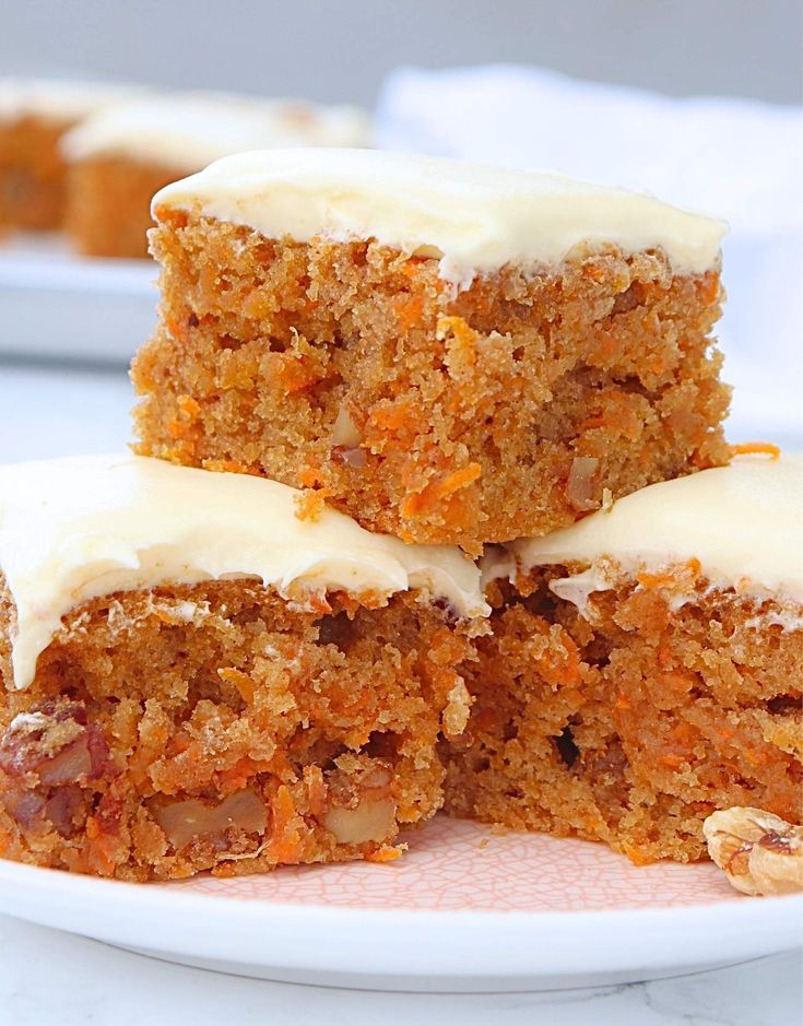 three pieces of carrot cake on a plate