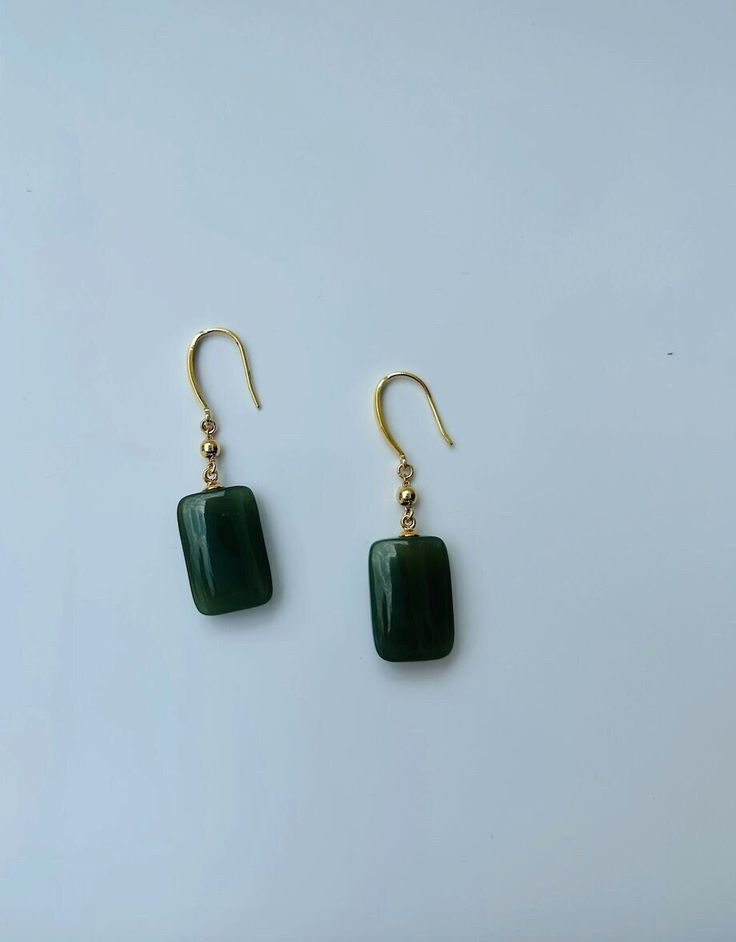 A pair of elegant rectangle-shaped dark green jade cube earrings with 14k gold ear wire. They are made from high-quality real Chinese jade and 925 sterling silver plated with 14k gold. Simple and minimalistic design works great for all sorts of occasions: dating, daily wear, home or office, you name it. Perfect as a gift for your loved ones or yourself. Highlights: ♥ High-quality materials Hand-made with quality dark green jade, paired with 925 sterling silver plated with 14k gold. Ensure long last wear and they are friendly for sensitive skin. ♥ Simple and minimalistic design Great for all sorts of occasions and perfect for gifting  ♥ Measurements Each drop is measured 1.5cm diameter and 2.5cm long. ♥ 100% Satisfaction Guarantee Gift-worthy packaging included! Please include a message if Cheap Green Minimalist Jewelry, Cheap Bohemian Green Earrings, Cheap Green Danglers Perfect As Gifts, Handmade Jade Earrings, Affordable Handmade Jade Earrings, Affordable Jade Bead Earrings, Cheap Everyday Green Earrings, Green Rectangular Earrings For Formal Occasions, Elegant Green Rectangular Earrings