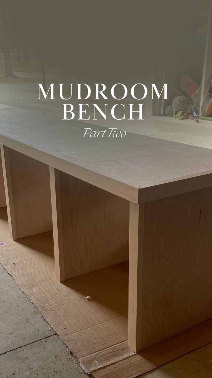 a table made out of plywood with the words mudroom bench next to it