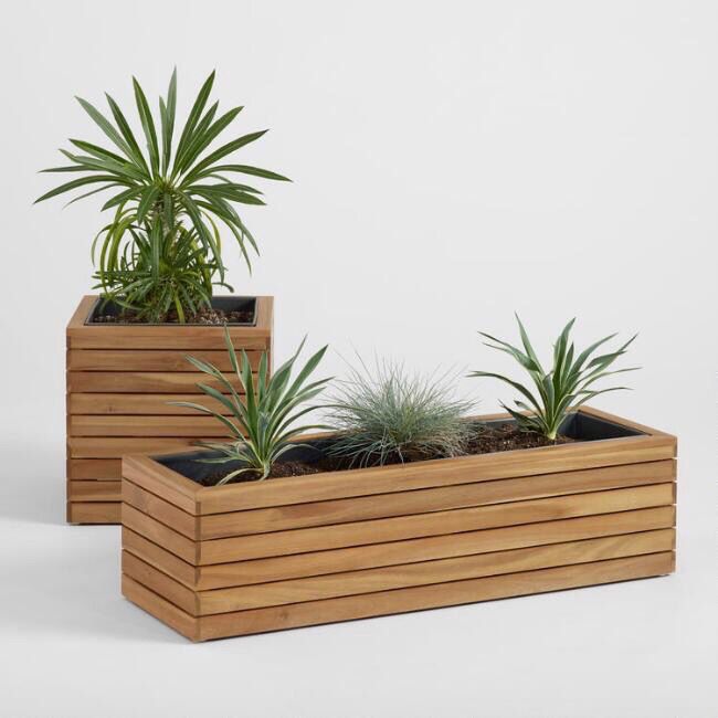 two wooden planters with plants in them