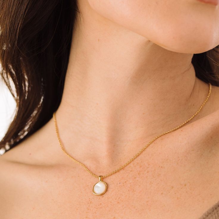 Introducing the Anna Pendant - a stunning, handmade piece of jewelry crafted with gorgeous Mother of Pearl and finished with a delicate gold rolo chain. This unique pendant is sure to be your favorite go-to accessory, adding just the right amount of glimmer and style to any outfit. Don't you deserve to feel luxurious and beautiful? Available in 14k gold plated brass 10mm Mother of Pearl Cabochon 18" rolo chain with 2" extender Lobster claw closure SKU: BYN1375 Gold Brass Necklace With Pearl Pendant, Refined Gold Pearl Pendant Necklace, Timeless Gold-plated Pearl Pendant Jewelry, Minimalist Gold-plated Pearl Pendant Necklace, 14k Gold-filled Pearl Pendant Necklace As Gift, Modern Jewellery Design, Pearl Pendant Necklace, Rolo Chain, Unique Pendant